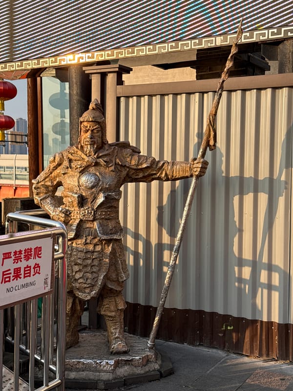 Tourists explore bronze sculpture park with city views in Yuzhong