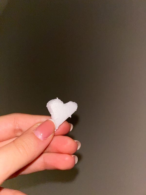 Person holds white heart-shaped object in Sofia