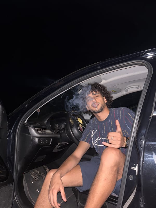 Thumbs-up from a parked car at night in Tangier