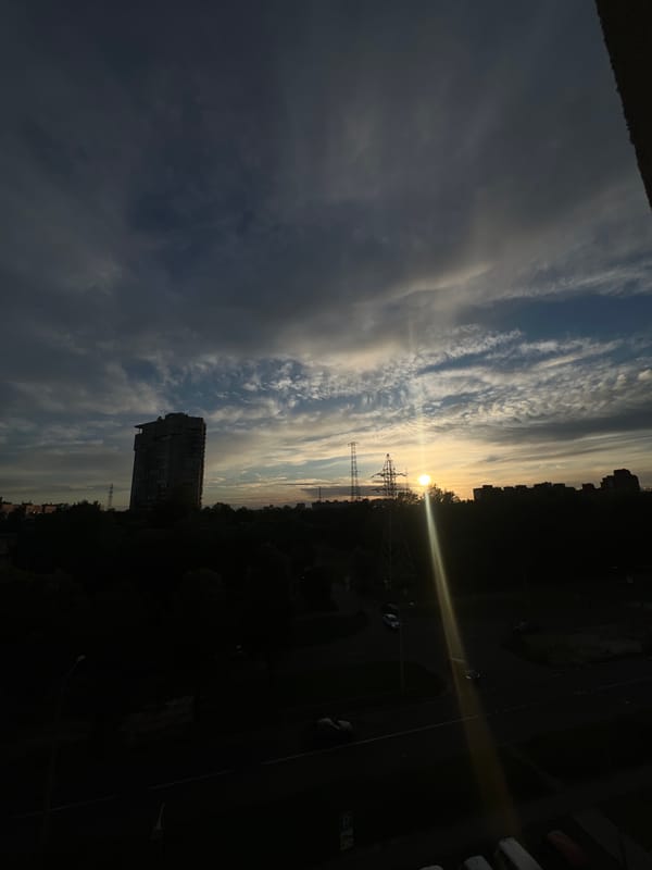 Sunset over Shushary's pylons and rooftops, June 2026