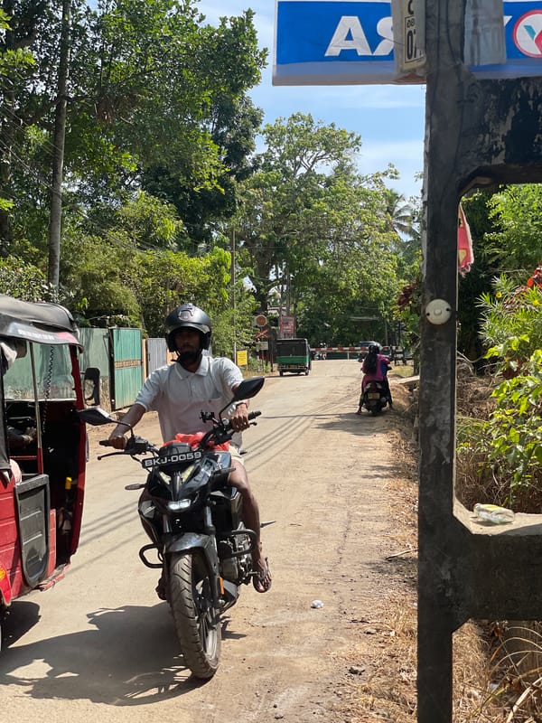 Motorcyclist spotted on street in Polwathumodara, Sri Lanka