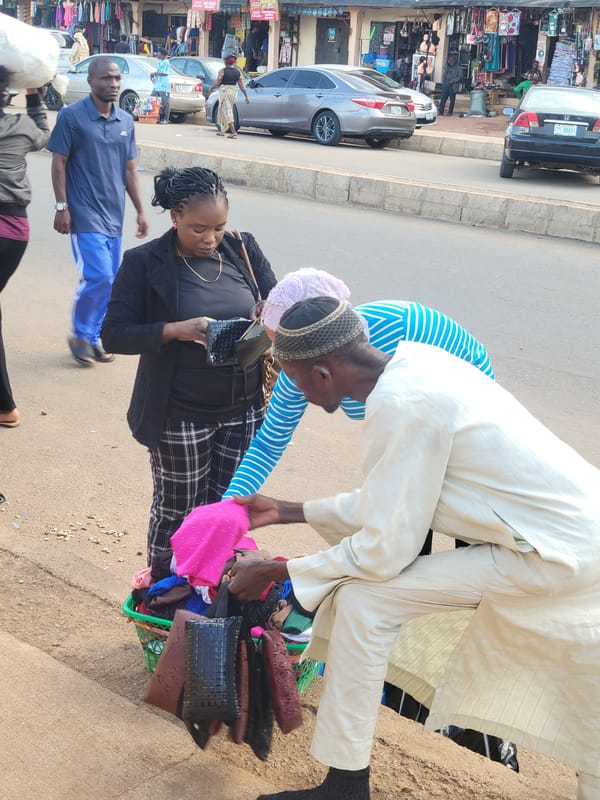 Street market in full swing, goods moving and deals happening