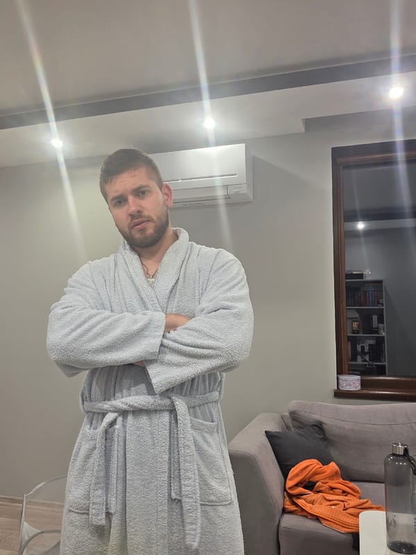 Man enjoys quiet evening at home with pet rabbit