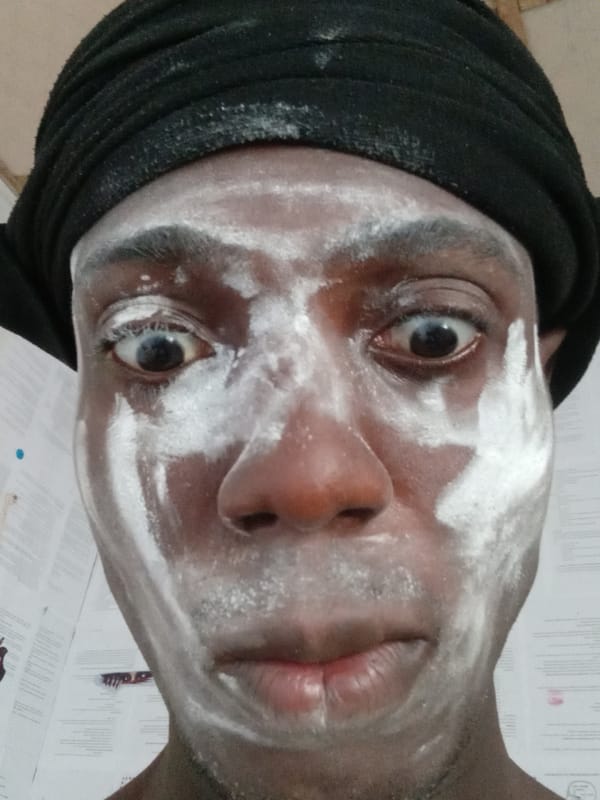 Person in Akwete applies face cream, supports collective memory