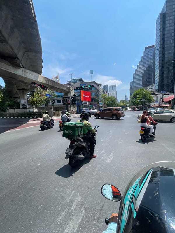 Morning motorcycle traffic observed in Bangkok streets