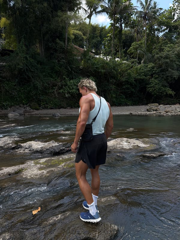 Man explores rocky river areas in Indonesia morning