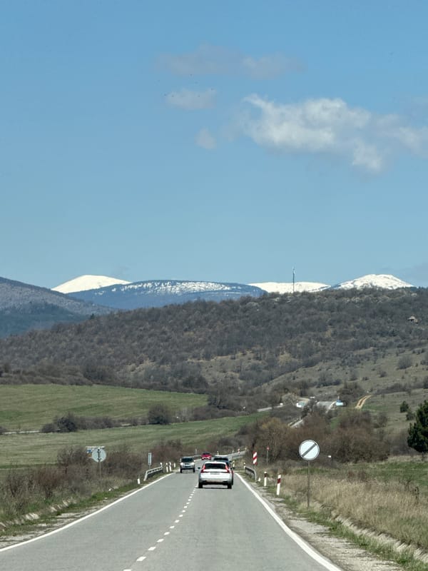 Road scene documented in Drenovo, Bulgaria with mountain backdrop