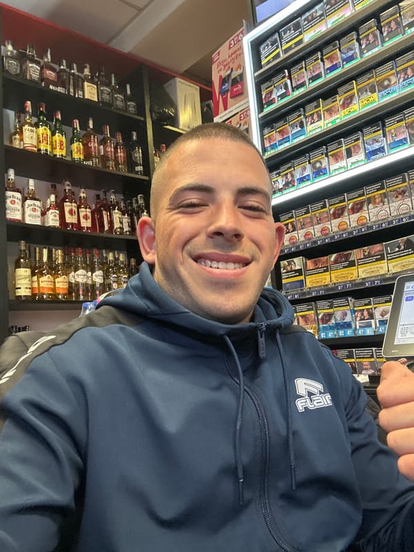 Man takes selfie in Sofia convenience store