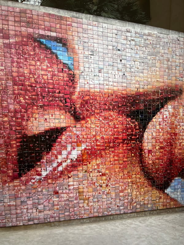 Mosaic mural of person documented in tile artwork
