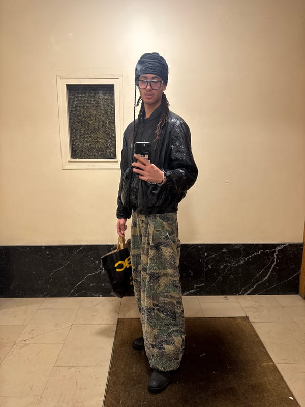Person takes selfie in Paris building hallway