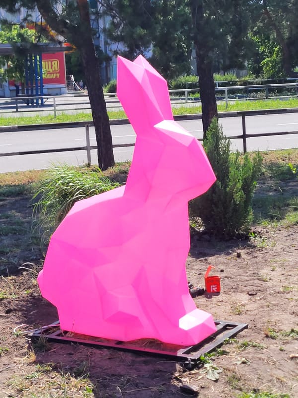 Pink rabbit sculptures displayed outdoors in Horishni Plavni, Ukraine