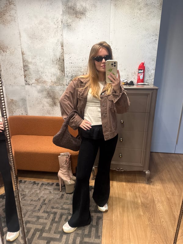 Woman takes mirror selfie in Hrodna, Belarus