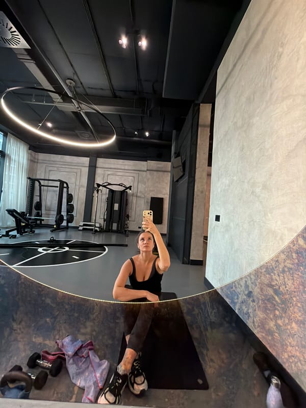 Woman documents morning routine with fitness, food, and cat in Belgrade