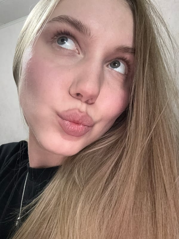 Woman documents afternoon with cat in Perm apartment selfies