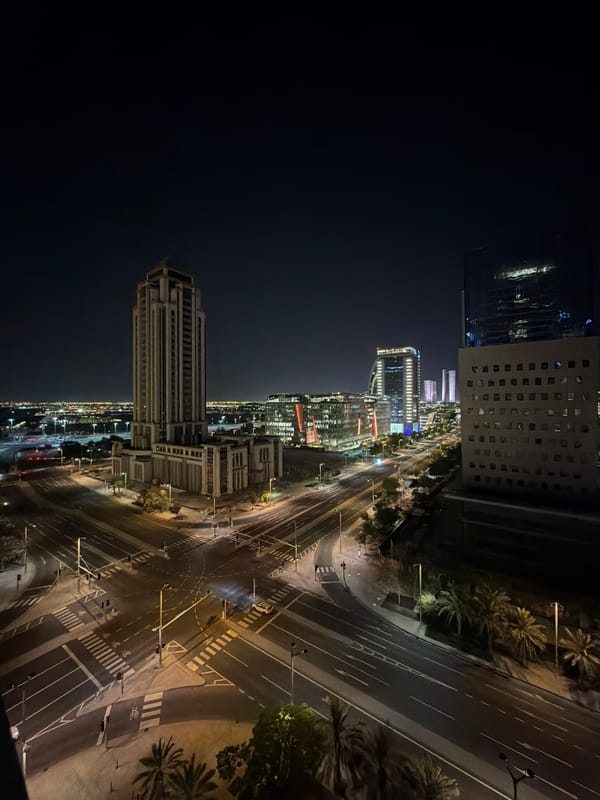 Lusail at night: glowing Ferris wheel and city infrastructure