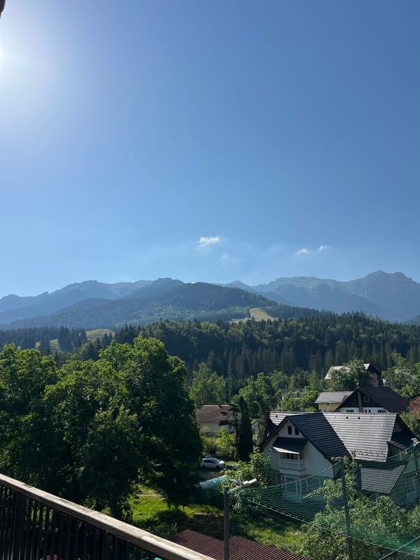 Balcony views over a quiet mountain village on a clear day