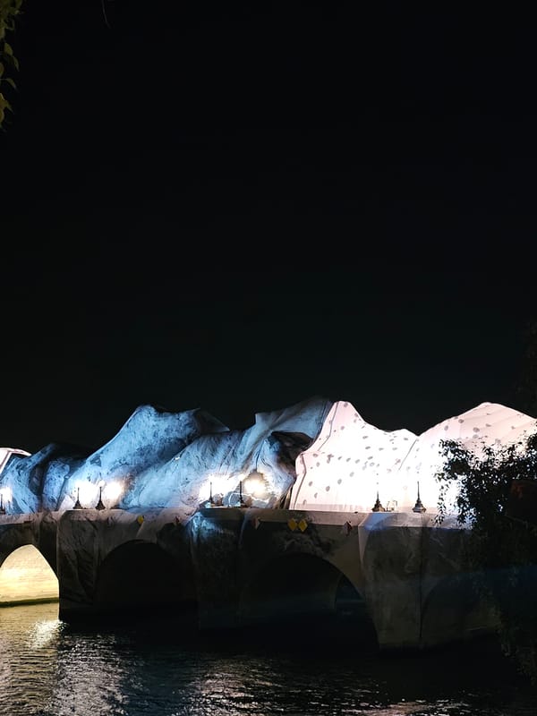 Nighttime scenes captured at illuminated Pont au Change bridge, Paris