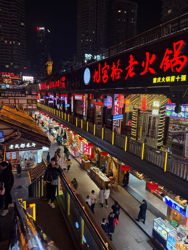 Traditional costume enthusiasts gather at Chongqing's illuminated Hongyadong complex