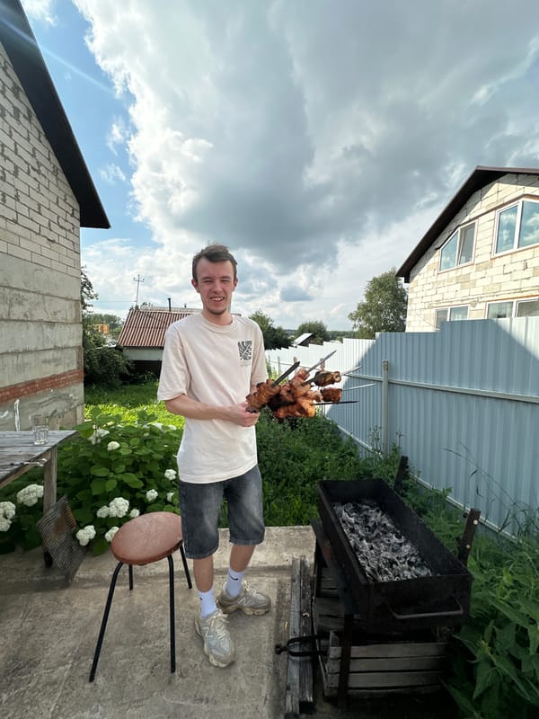 Backyard shashlik cookout in Chaikovsky with a German Shepherd in tow