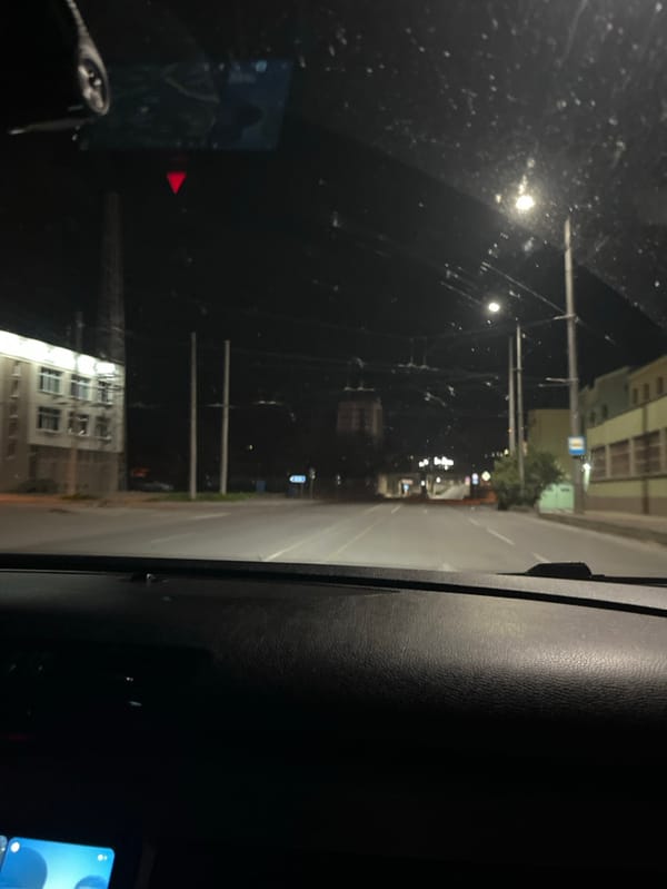 Nighttime street view captured from inside moving vehicle