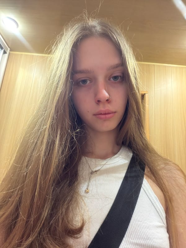 Elevator selfies, a black cat, and a forest path