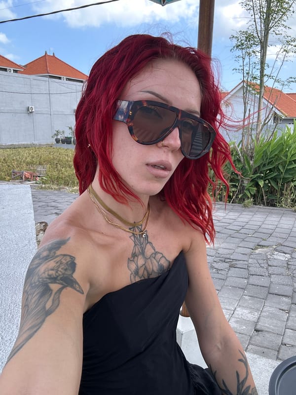 Red-haired woman photographed at North Kuta resort setting