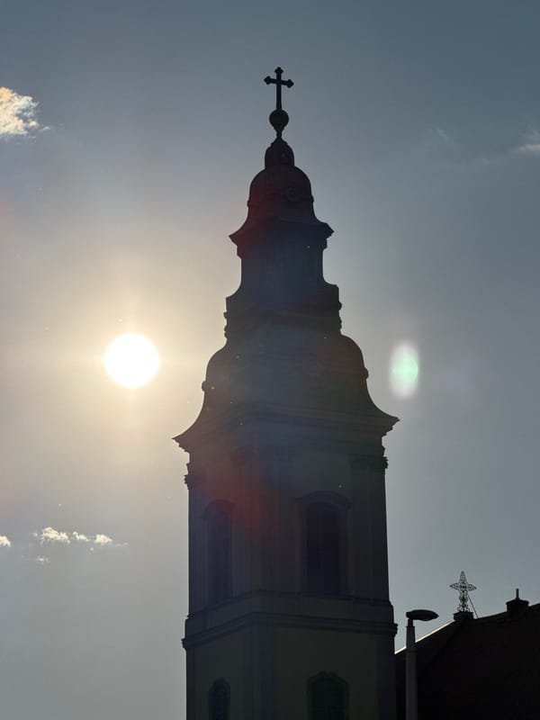 Budapest church towers documented under bright afternoon sun