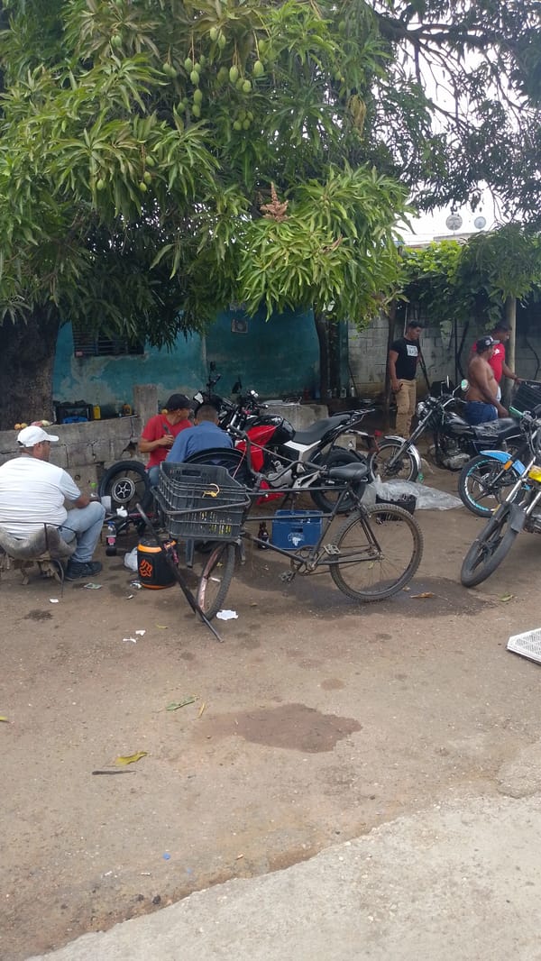 Street motorcycle repair documented in Tinaquillo, Venezuela