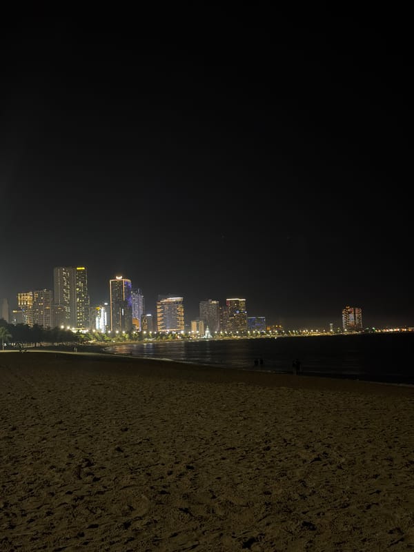Evening beach life captured under full moon in Nha Trang