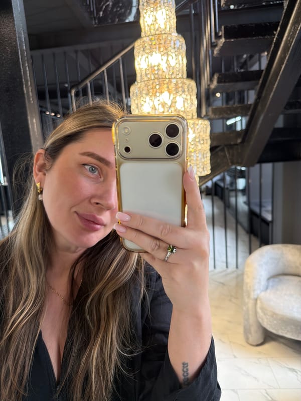 Woman takes mirror selfies in upscale Moscow interior