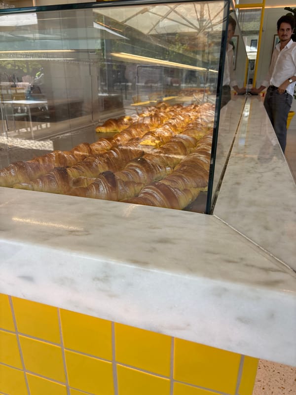 Croissants displayed in Lisbon bakery case