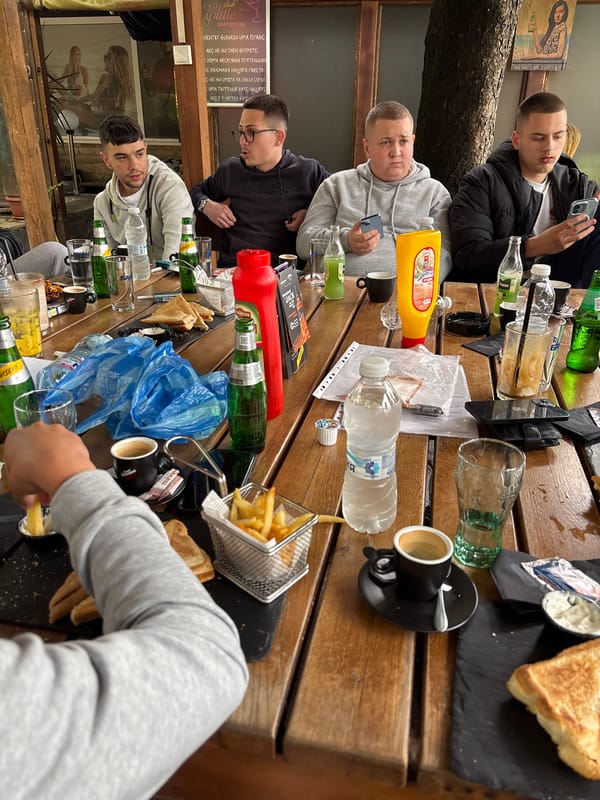 Young men dine outdoors at Elite restaurant in Zlatograd