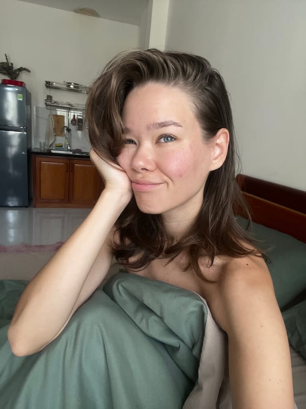 Woman resting in bed captured in Nha Trang residence