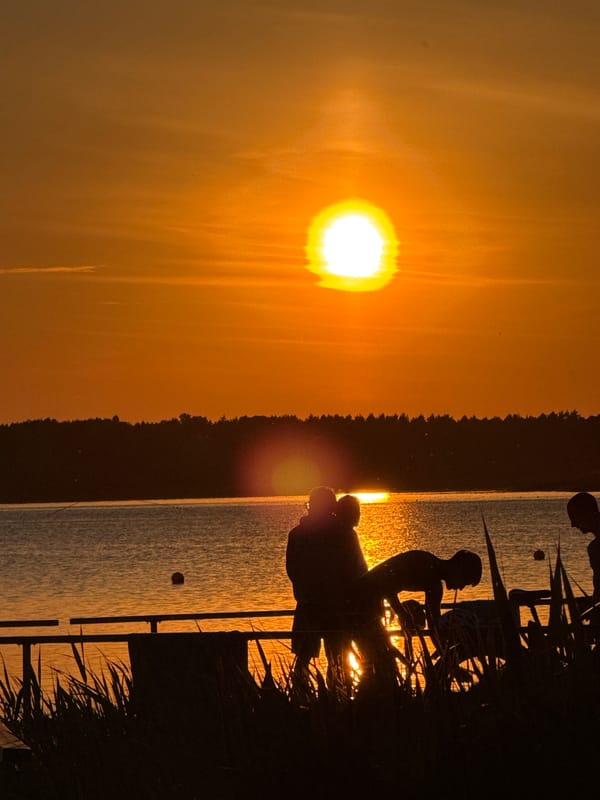 Sunset over water captured from wooden pier in Tiskre