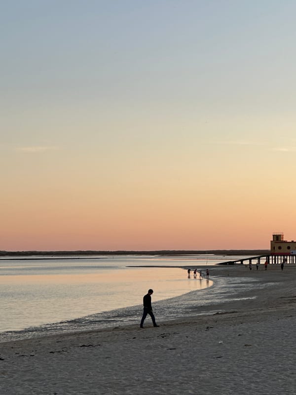 Evening fishing activity observed along Olhão breakwater and lighthouse