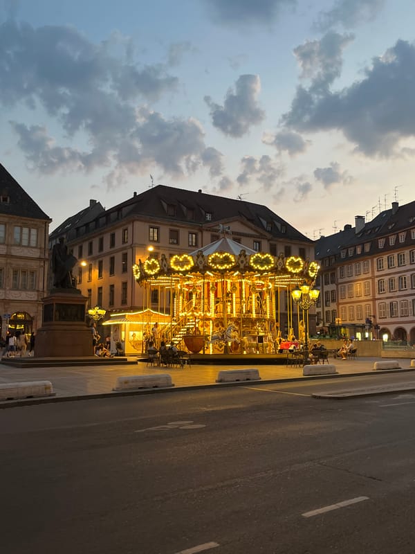 Carousel lights up Place Kléber on a Strasbourg summer evening