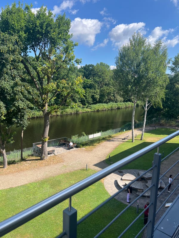 Police and leisure boats share a Teltow canal on a summer morning