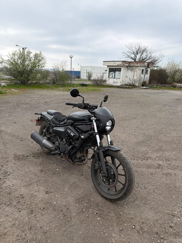 Black motorcycle parked in industrial lot in Burgas, Bulgaria