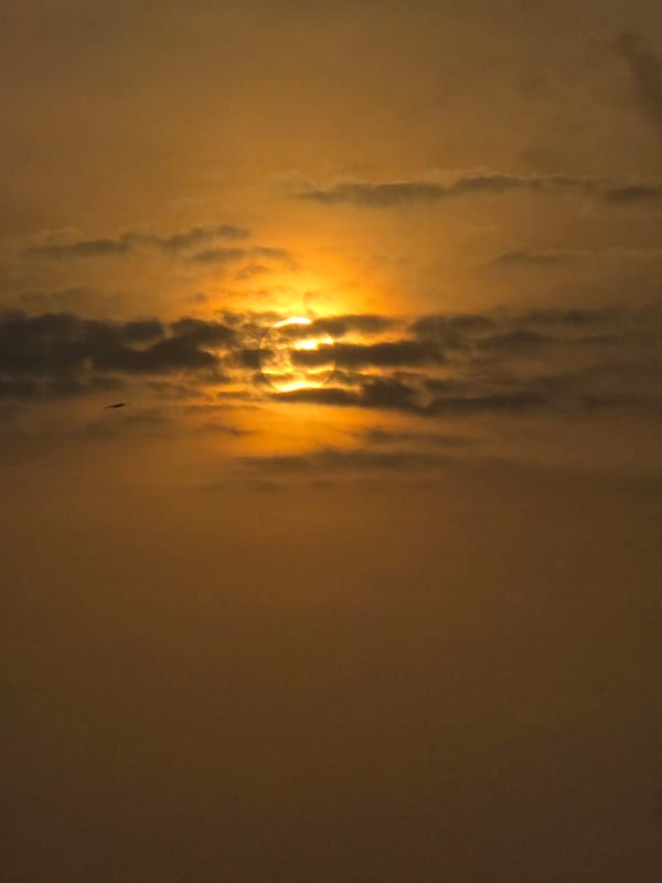 Orange-tinted cloudy sky observed in Mumbai