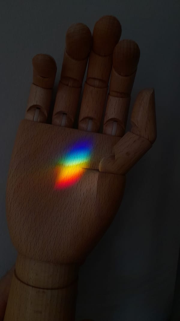 Rainbow light projections documented across surfaces in Saint Petersburg