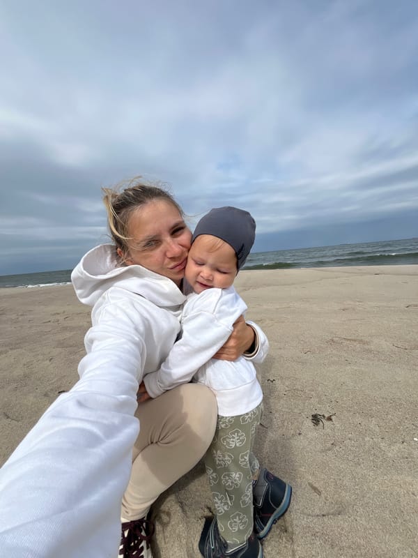 Laid-back beach day with a baby, selfies, and distant ships