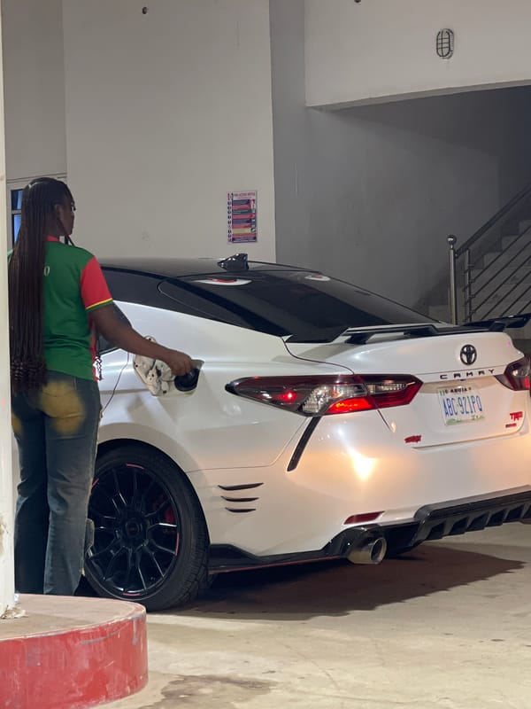 Late-night fuel stop in Guzape with a custom Camry