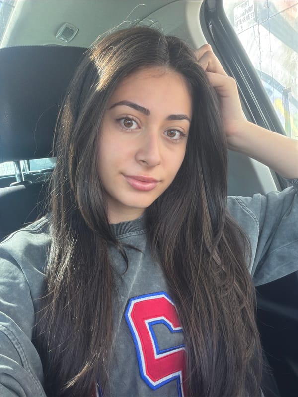 Woman photographed in car wearing numbered sweatshirt in Sofia
