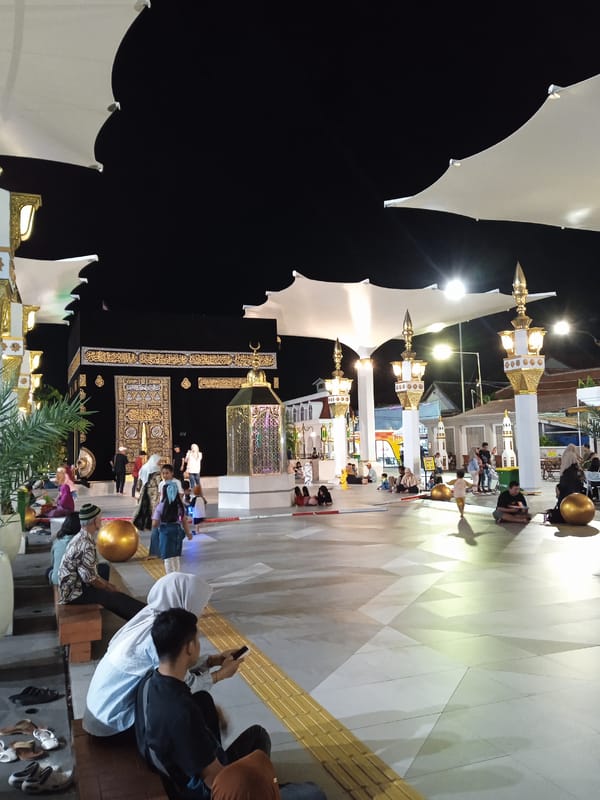 Families gather at illuminated cultural plaza in Madiun, Indonesia