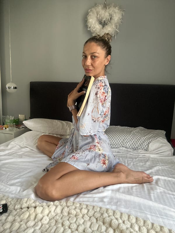 Quiet afternoon reading session on a white bed