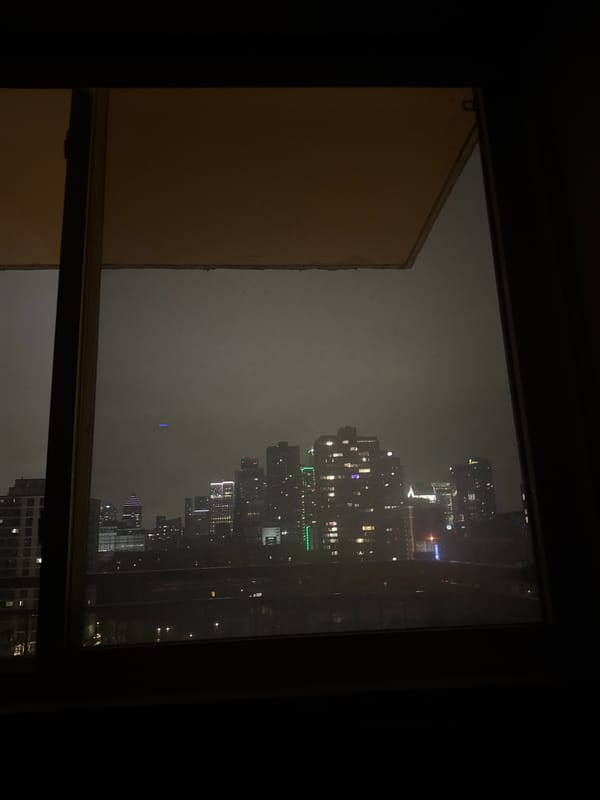 Montreal skyline viewed through window on foggy night