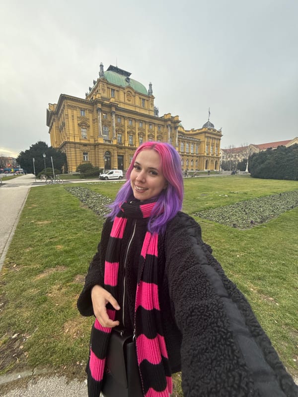 Colorful-haired tourist explores Zagreb's historic center on Saturday afternoon