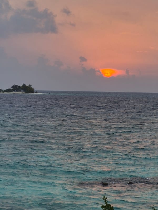 Sunset observed over ocean waters in Huraa, Maldives