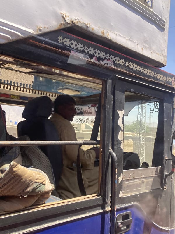 Driver rests in decorated truck cabin in Quetta