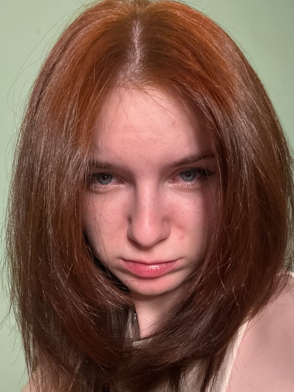 Red-haired woman photographed in bedroom setting over six minutes